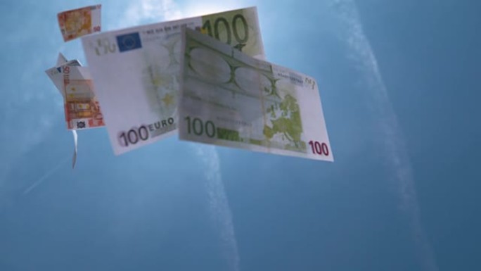 慢动作特写: 成堆的欧洲资金从晴朗的天空中掉落