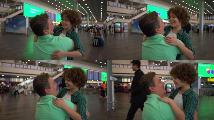 慈爱的父亲在儿子刚降落在机场时拥抱并与他交谈