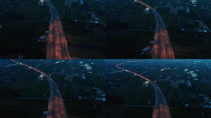 4k鸟瞰图和多莉在夜间倾斜道路拍摄。