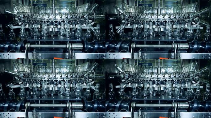 酒精生产厂的现代机器清洗瓶。