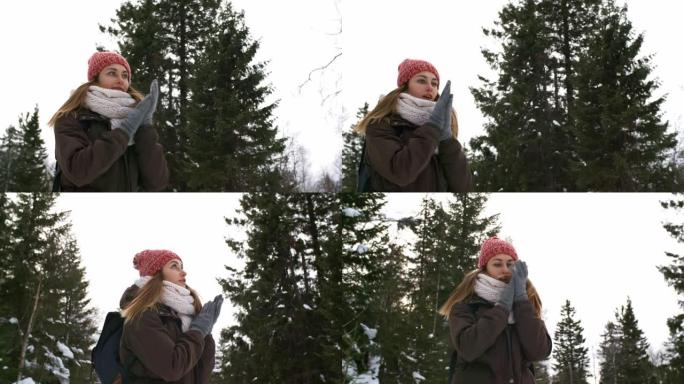 寒冷的冬季森林中的女人