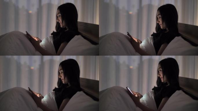 女人在床上使用约会社交应用