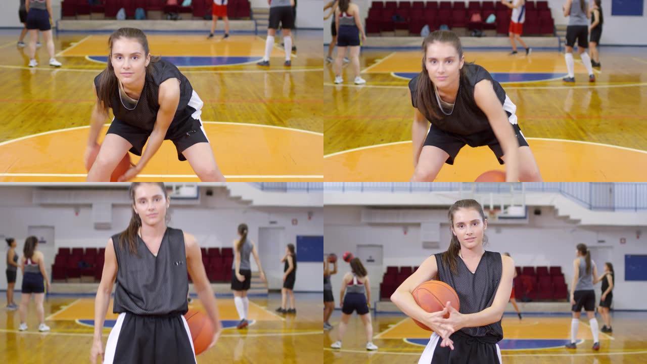 年轻的运动女孩在相机上表演篮球动作