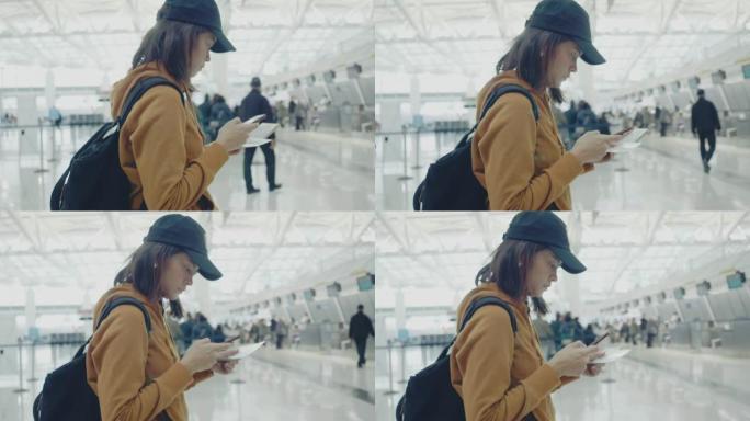 游客使用电话在机场在线办理登机手续