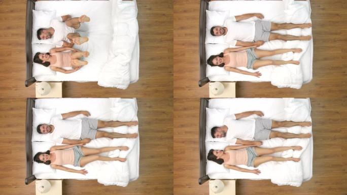 男人和女人在床上做运动。从上方观看