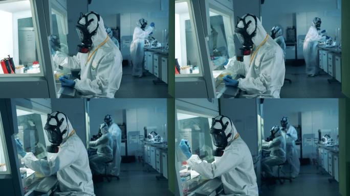 实验室工作人员在实验室使用工具时开发新型冠状病毒肺炎疫苗。