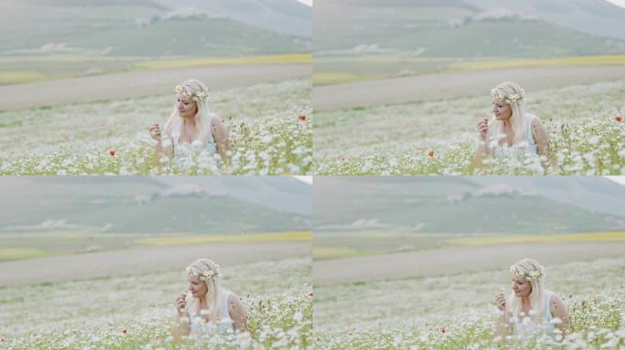 女士在意大利翁布里亚的Castelluccio的雏菊草地上戴着花冠的宁静年轻女子