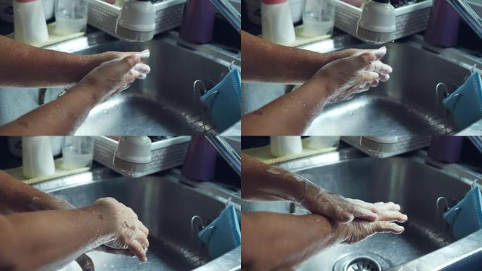 祖母在家厨房用汤洗手。