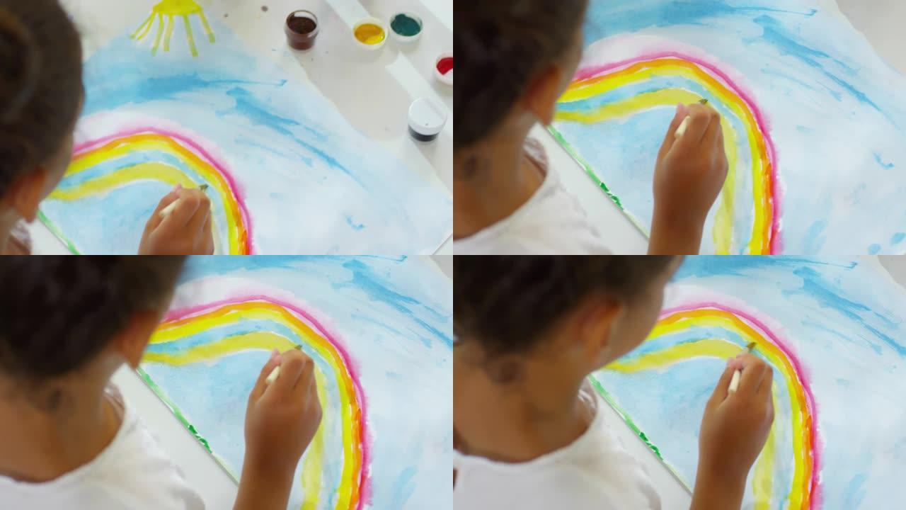 无法识别的女孩在学校画彩虹