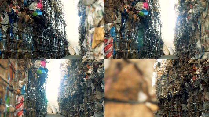 垃圾场有很多废纸，特写。捆绑的纸板堆在垃圾场进行回收。