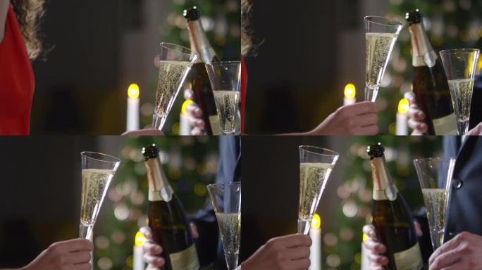 无法识别的夫妇在新年聚会上享受香槟