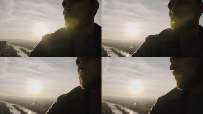 巴黎日落天空全景慢动作埃菲尔铁塔年轻快乐微笑高加索男子的超级特写肖像。