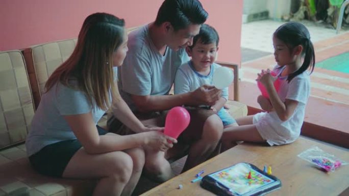 亚洲家庭吹气球外国人亲子陪伴亲子互动