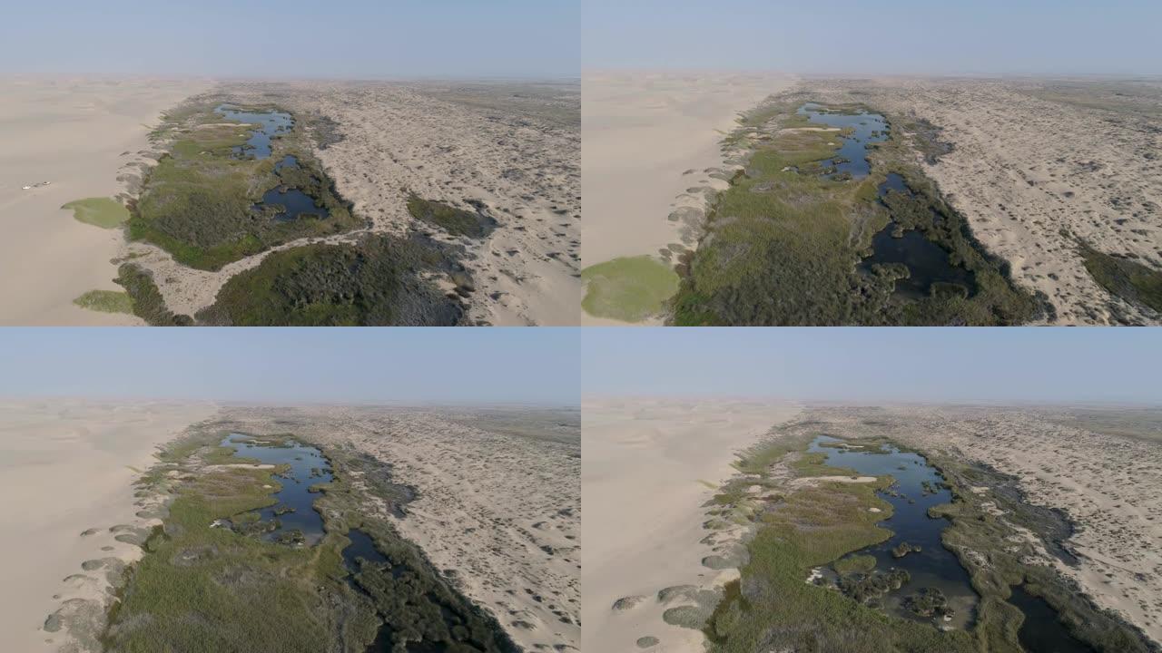 纳米比亚骷髅海岸纳米布沙漠绿洲泉的4k空中飞行