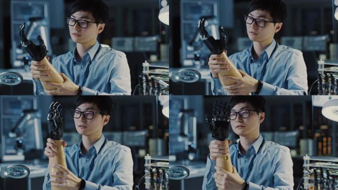 未来的假肢机器人手臂由专业的日本开发工程师在高科技研究实验室中使用现代计算机设备进行测试。