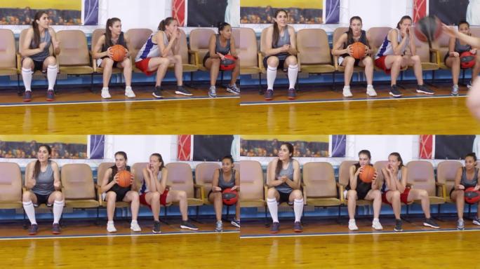 女运动员观看比赛和支持篮球队