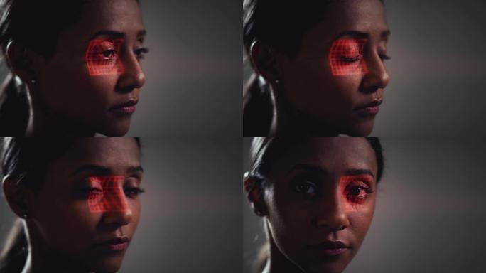 人脸识别技术概念作为女人有红色网格投影到眼睛在工作室
