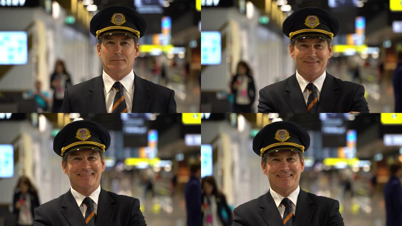 快乐的飞行员在机场面对镜头微笑