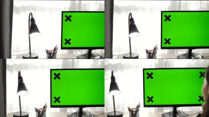 绿色模拟屏幕个人电脑站立的办公桌照片