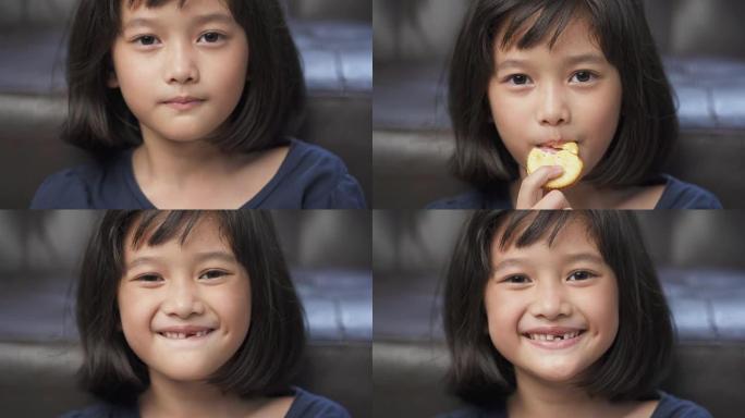 封闭的亚洲年轻女孩喜欢在家吃饼干