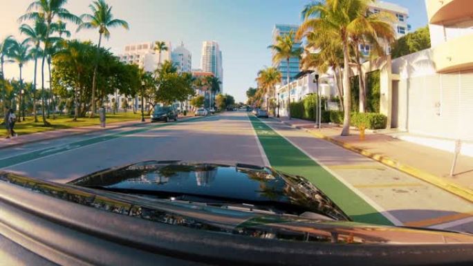 MS POV汽车沿着美国佛罗里达州迈阿密的阳光街行驶