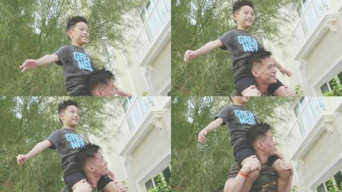 菲律宾父亲与儿子在肩膀上玩耍的慢动作视频