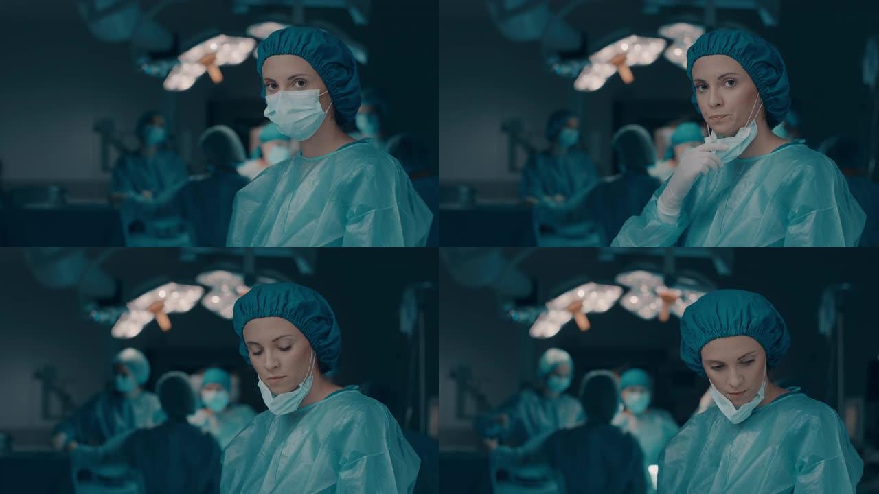 悲伤的护士脱下外科口罩的肖像