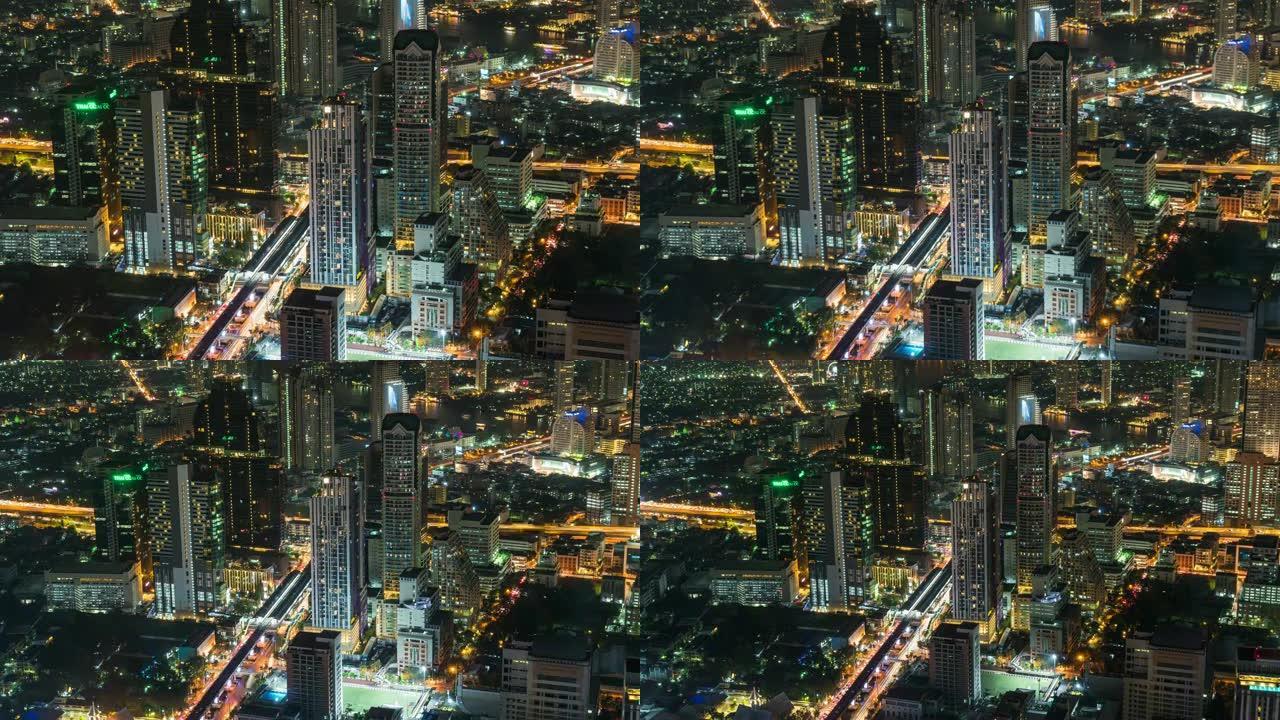 4k延时过渡缩小曼谷夜间高峰时段交通交叉口和道路建筑建筑的高架城市景观，城市景观概念交通