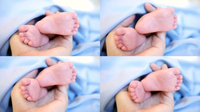 母亲手中的新生婴儿脚