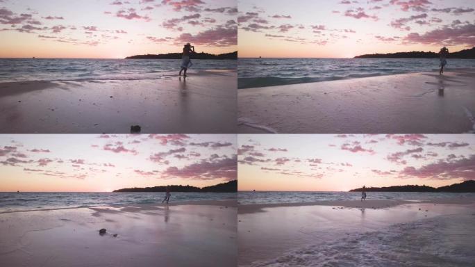 在美丽的白色海滩上奔跑，跳舞并玩乐的女人的鸟瞰图，周围是清澈晶莹的大海。