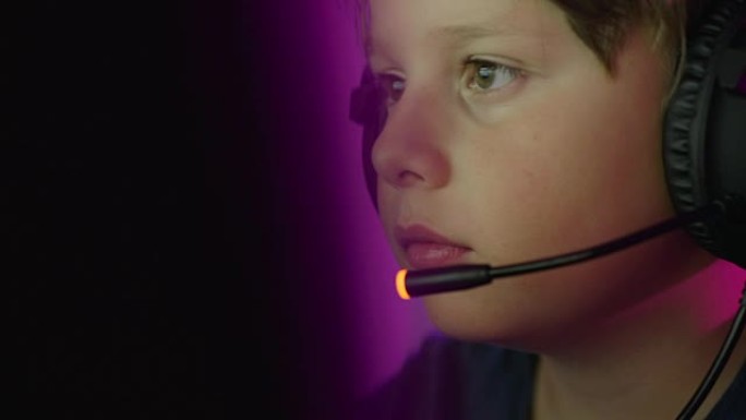 Young boy playing online computer games