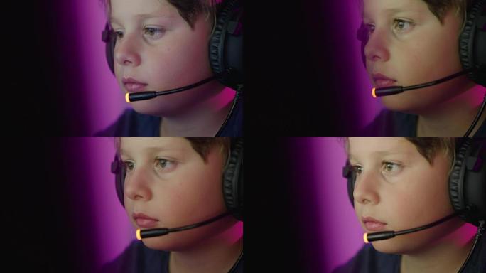 Young boy playing online computer games