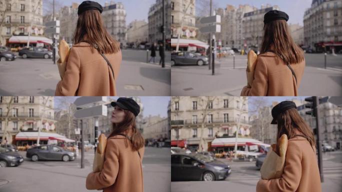 相机跟随美丽时尚的食物博主女人在网上发帖，手机沿着巴黎街慢动作行走。