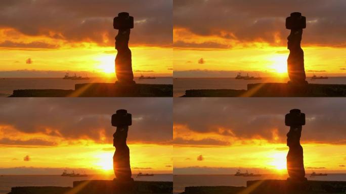 空中: 夏天的日落照亮了宁静的海洋和大摩艾雕像