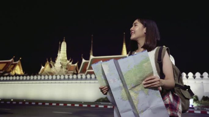 4k分辨率亚洲女性旅行者拿着地图寻找方式，生活方式理念