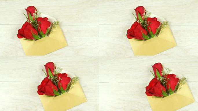 打开黄色信封，红色玫瑰在白色木制背景4k