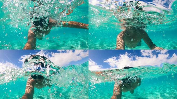 一个男人正在海里潜水并拍摄自己
