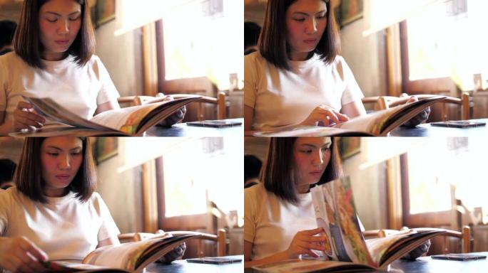 女人在餐厅阅读菜单，慢动作