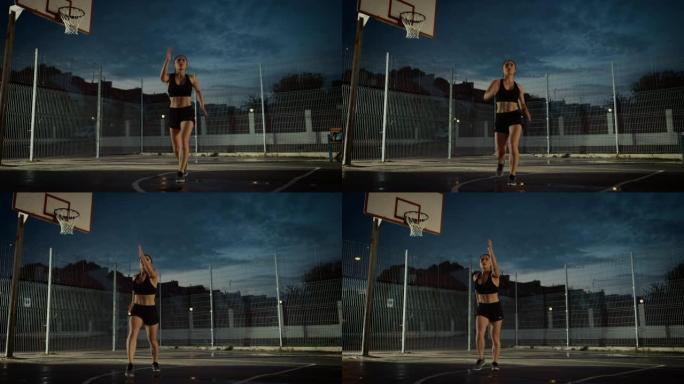 美丽精力充沛的健身女孩做操。她正在一个有围栏的室外篮球场里锻炼身体。居民区下雨后的晚间录像。