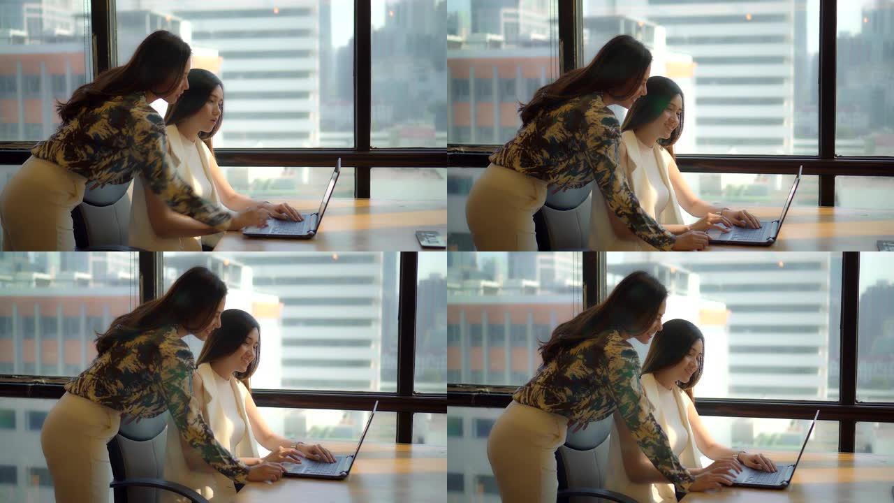 在办公室使用笔记本电脑培训的女企业家