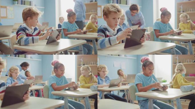 小学计算机科学课: 聪明的男孩使用数字平板电脑，他的同学也使用笔记本电脑。儿童在STEM，游戏和学习