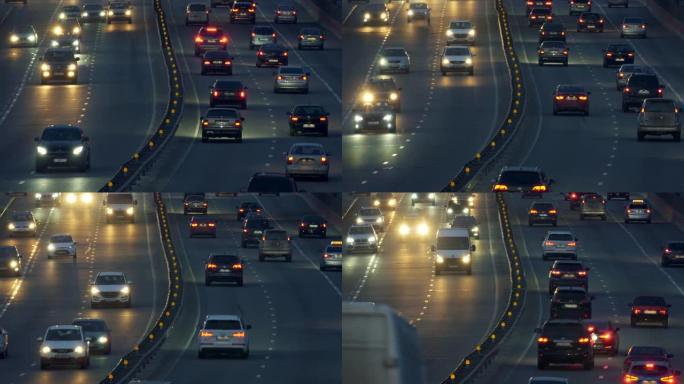 黄昏时，高速公路上的汽车开着灯。城市中的夜间汽车交通。UHD