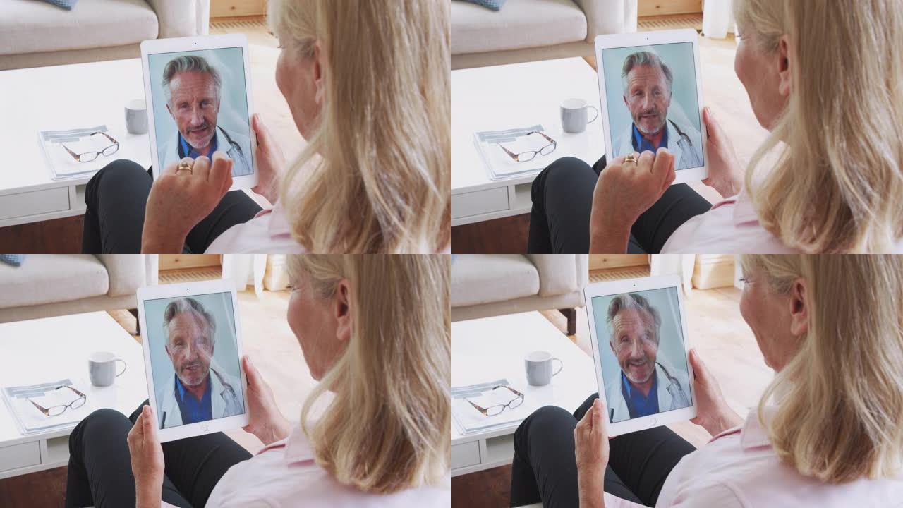 成熟的女人在数字平板电脑上与医生在线咨询