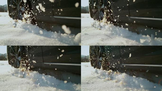 慢动作: 在阳光明媚的日子里，汽车在公路上行驶时会吐出湿雪。