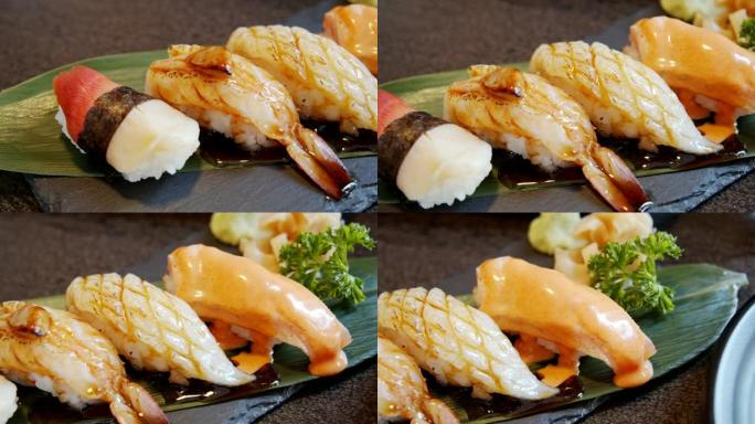 在日本餐厅混合优质寿司套装。三文鱼、ebi虾、engawa鱼。健康食品概念