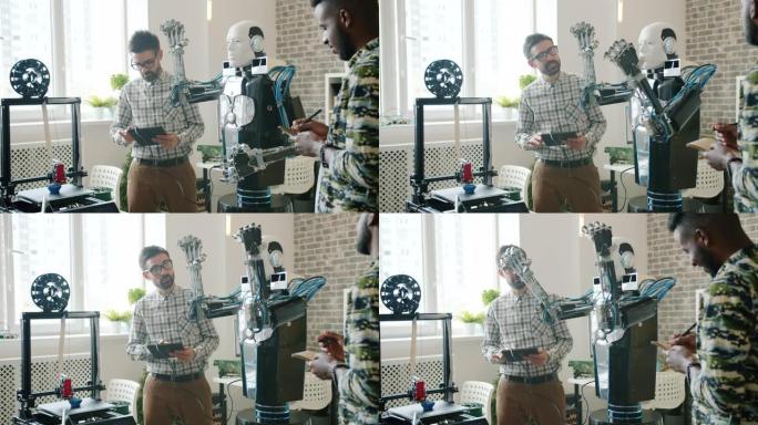 伙计们在办公室用平板电脑、3d打印机在后台工作来测试酷机器人