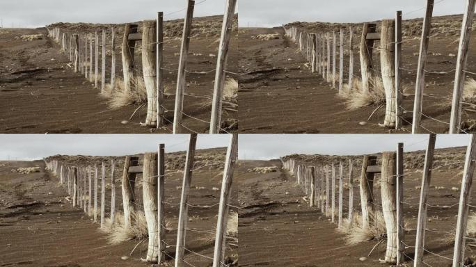 阿根廷巴塔哥尼亚干旱地区的旧风化篱笆柱。