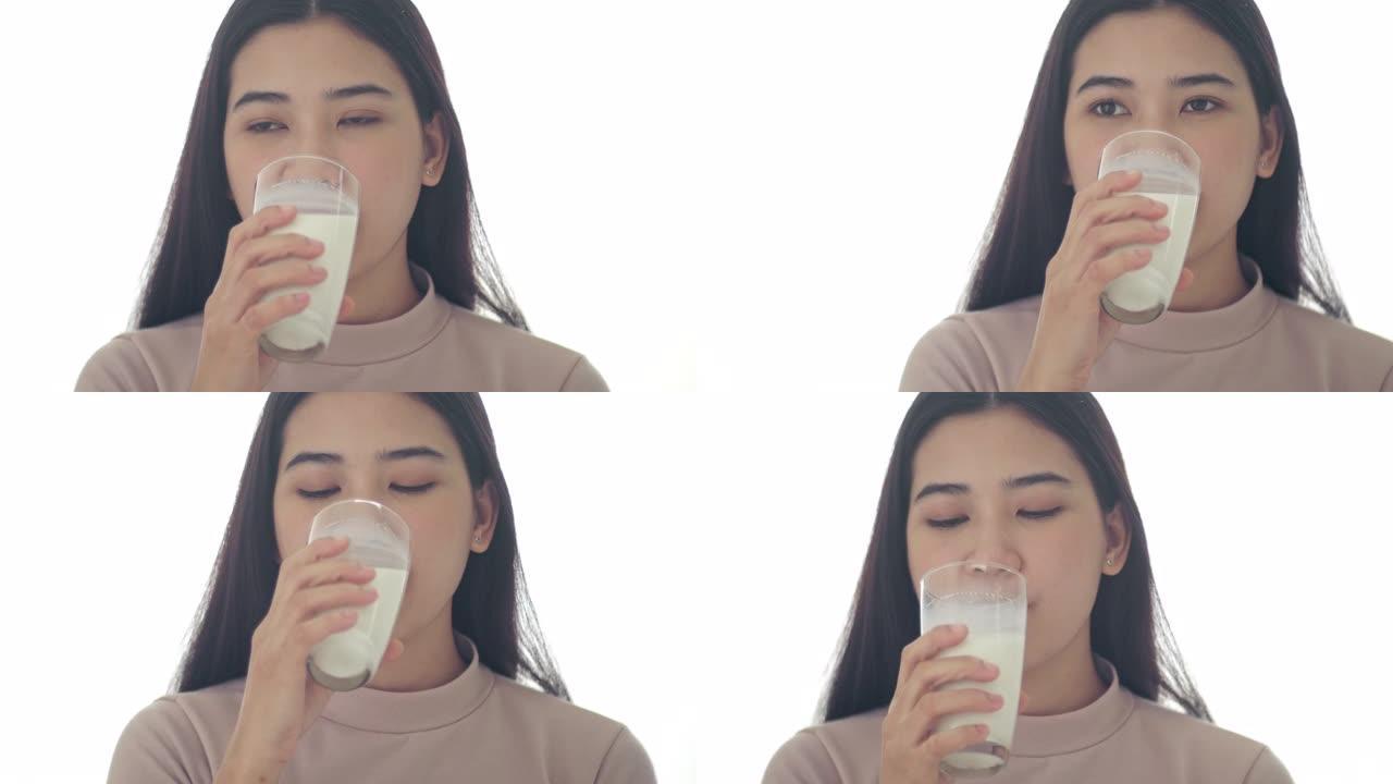 亚洲妇女喝新鲜牛奶