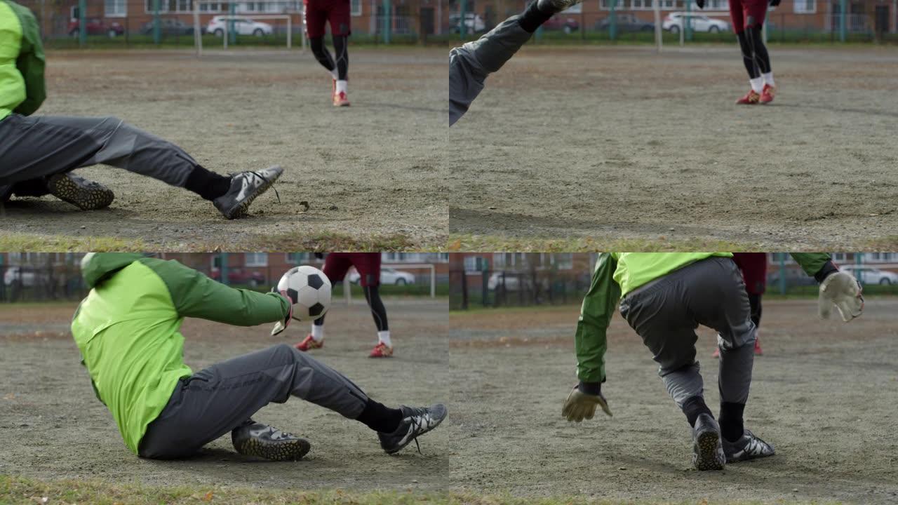 足球守门员扑救并摔倒在地上