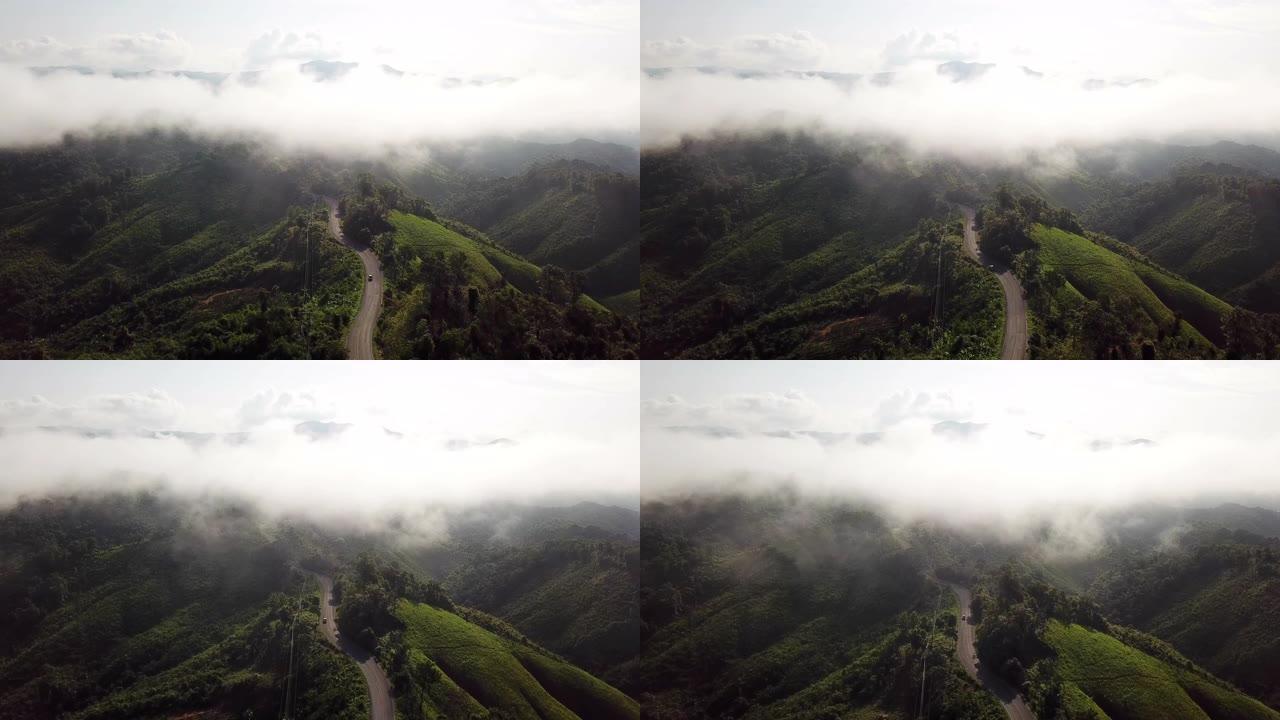 山上蜿蜒道路的鸟瞰图和汽车驾驶，安全驾驶理念